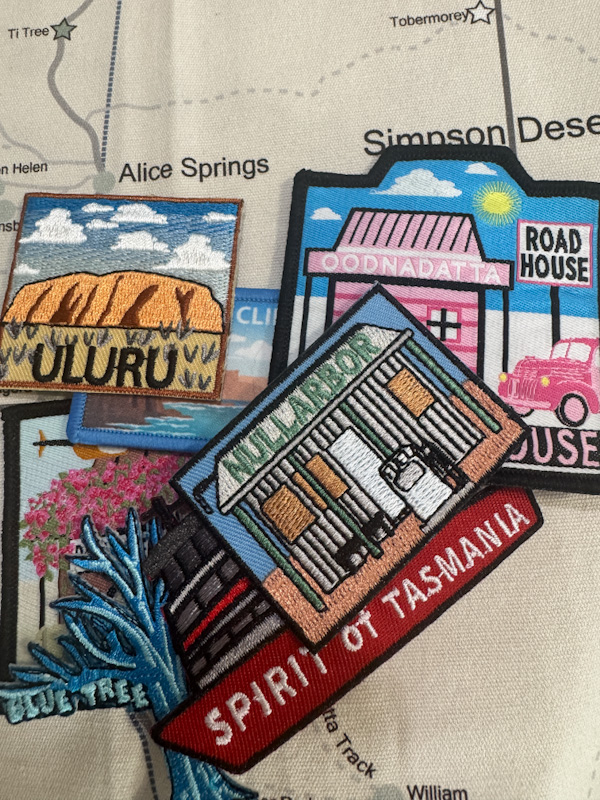 Twelve embroidered Australian travel patches — Uluru, Pink Roadhouse, Spirit of Tasmania and more